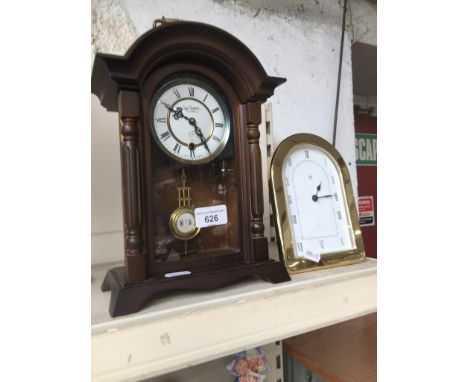 Two mantel clocks, one being duchateau 