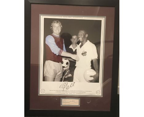 Pele + Bobby Moore Signed Framed Picture: Large Ltd edition print of Moore in West Ham kit and Pele in Santos kit in 1970. Pe