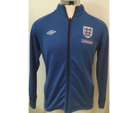 England Signed Football Shirts + Track Suit Top: 3 different era white home England shirts all signed without dedication by T
