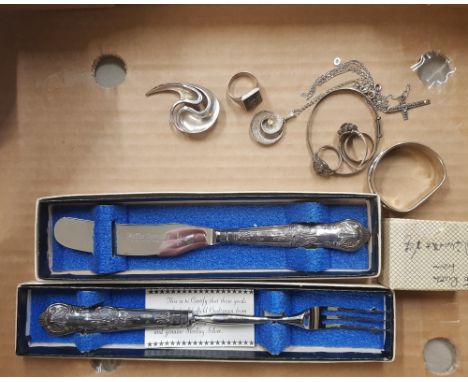 A collection of silver items to include silver handled pickle fork, silver handled table knife, silver Christening bracelet, 