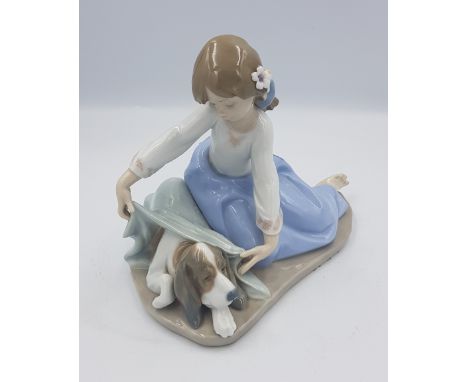 Lladro figure of a girl with a puppy, model 5688. 