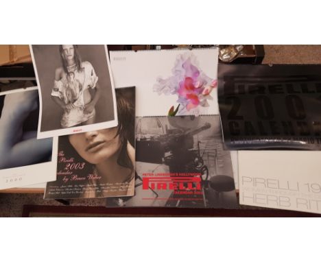 Seven boxed Pirelli calendars dating from  1998, 1999, 2000, 2001, 2002, 2003 and 2004 