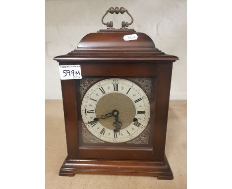 A mahogany cased 'Smiths' bracket clock, key and pendulum present. 