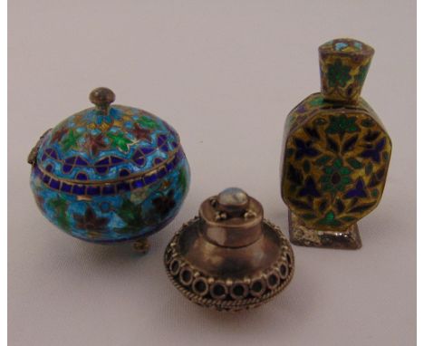 A white metal and enamel pill box, a white metal and enamel bottle and a white metal pill holder, approx total weight 70g