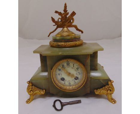 A French late 19th century onyx and gilt metal mantle clock with circular white enamel dial, Arabic numerals, two train movem