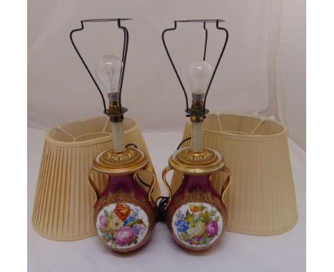 A pair of continental lamp bases, Viennese style, baluster form, decorated with floral sprays to include silk shades, 52cm (h