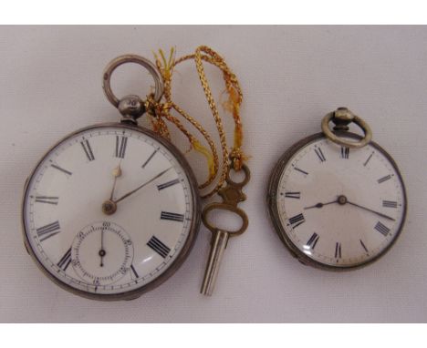 Two silver open faced pocket watches both with white enamel dials and Roman numerals