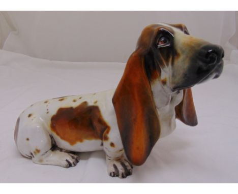 An Italian signed life size ceramic model of a Bassett Hound circa 1960s, 28cm (h) 43cm (w)