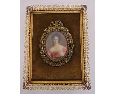 A portrait miniature of a lady in ornate gilt metal frame, indistinctly signed, 8x 6cm
