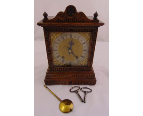 A Victorian rectangular oak cased mantle clock, the silvered dial with Roman numerals, two train movement to include pendulum
