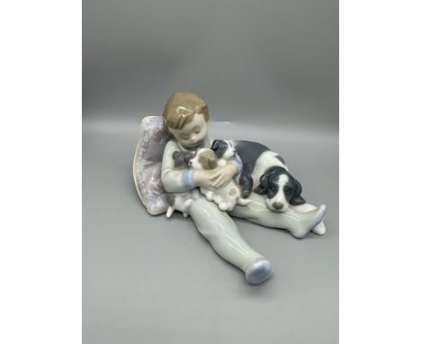 Lladro Boy on Cushion with Pups and Dogs
No cracks, no chips, no restoration or any other kind of damage