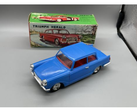 Boxed Vintage Jimson Triumph herald plastic car.