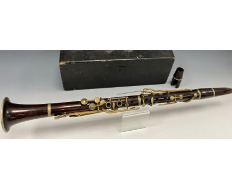 A late 19th century rosewood clarinet, unsigned four section body, silver plated mounts and valves, 63.7cm long, cased