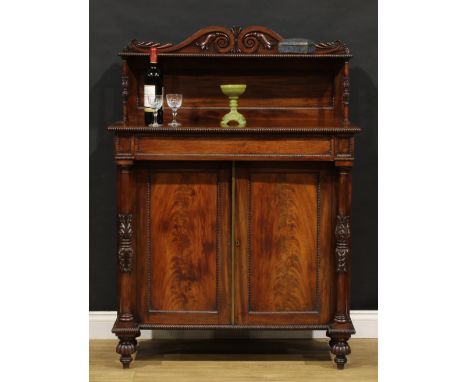 A George IV mahogany chiffonier, possibly Scottish, shaped cresting carved with acanthus scrolls, above a rectangular superst