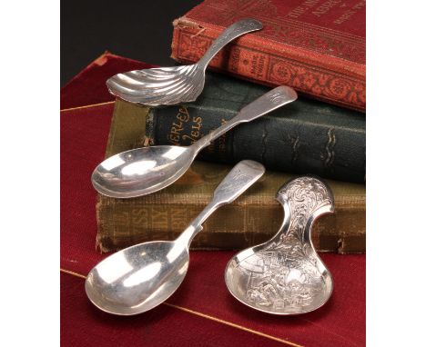 A Victorian silver Fiddle pattern caddy spoon, 10cm long, Henry Holland, London 1856; others, various dates and makers (4)