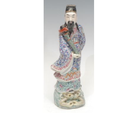 A Republic Period Chinese porcelain figure, of a warrior standing on a frog, decorated in the Famille Rose tradition, impress