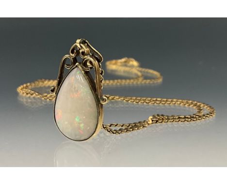 A 9ct gold opal tear drop cabochon pendant necklace, with red, green, blue and violet colours, approx 17mm x 12mm, x 3mm, unm