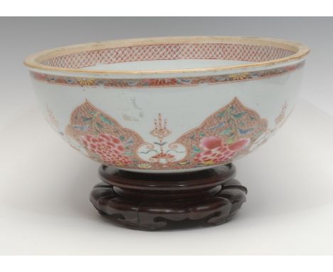 A 19th century Chinese export-ware porcelain water basin, decorated in the famille rose tradition with panels of flowerheads 