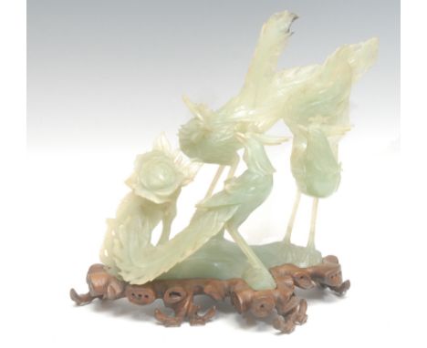 A Chinese export ware jade sculpture on stand, of cocks fighting, 24.5cm high overall