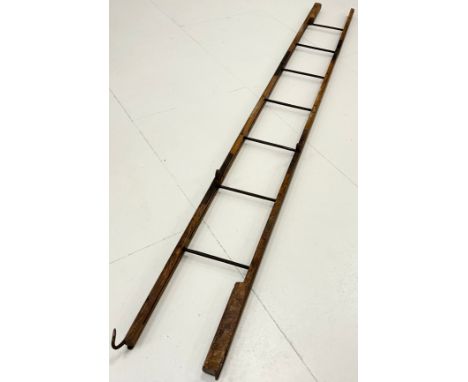 A WWI folding trench ladder, elm and cast iron construction, folding into three main sections, with metal rungs enclosed to i