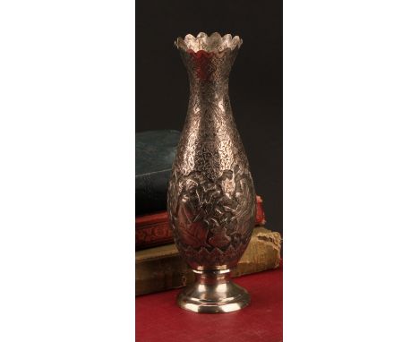An Iranian silver slender baluster vase, chased with narrative scenes on a dense lotus ground, 18cm high, Farsi mark, 146g
