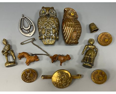 A brass vesta case. as an owl, another, set of three livery buttons; artists rifles button brooch, etc