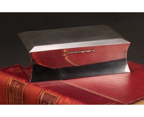 A large Art Deco silver waisted rectangular cigar box, the hinged cover engine turned and enclosing a cedar-lined compartment