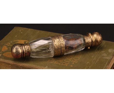 A 19th century gilt silver coloured metal 'binocular' form double-ended scent bottle, hinged to the centre, hinged and screw-