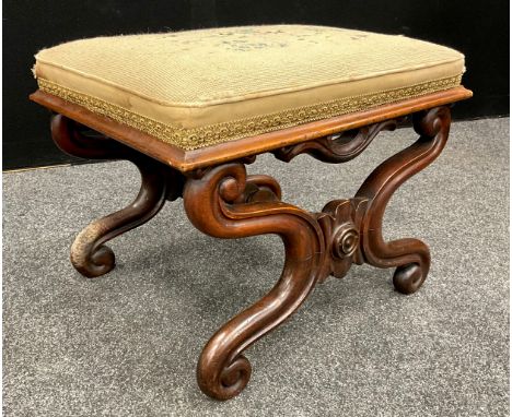 A William IV carved walnut X-frame stool, tapestry upholstered top, carved scrolling x-frame base, with single turned stretch