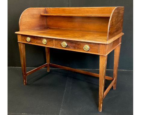 A George III walnut and mahogany writing table, high three-quarter galleried top with single shelf, above a pair of short dra