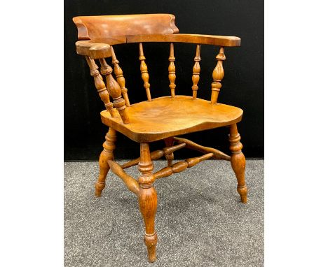 A 19th century beech and ash captains chair, bobbin turned supports, 79cm high, 61cm wide