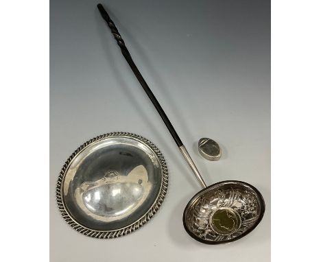 A George III silver oval snuff box or vinaigrette (no grille) Samuel Pemberton, London 1791;  a coin inset silver Toddy ladle