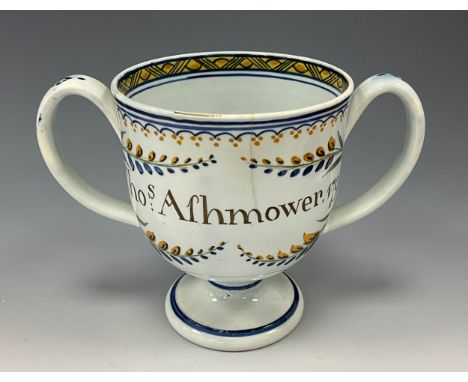 A late 18th century Prattware loving cup, inscribed  ‘Thos Afhmower.1795’, 13cm high