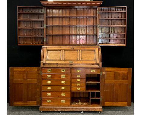 A Victorian walnut secretaire bureau cabinet, extensively fitted with an arrangement of shelves and pigeon holes to the top s