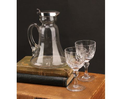An Edwardian silver mounted bell shaped claret jug, hinged cover, scroll handle, star-cut base, 17.5cm high, Chester 1908