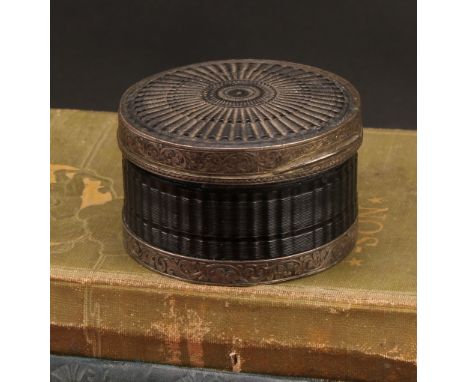 A late 18th century silver coloured metal mounted engine-turned tortoiseshell circular table snuff box, stand-away hinged cov
