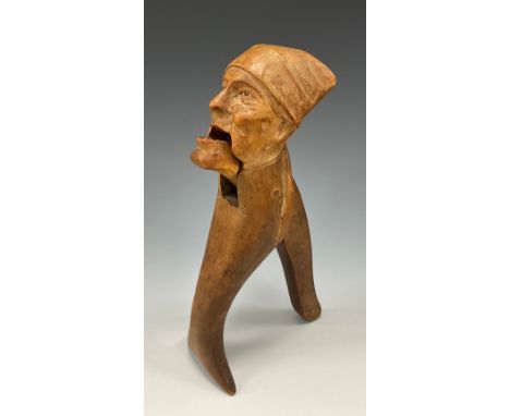 A 19th century novelty nutcracker carved as an old man in night cap, 21cm long