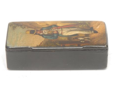 A Victorian papier-mâché snuff box, the hinged cover painted with a country gentleman carrying an umbrella, 9cm wide, c.1840