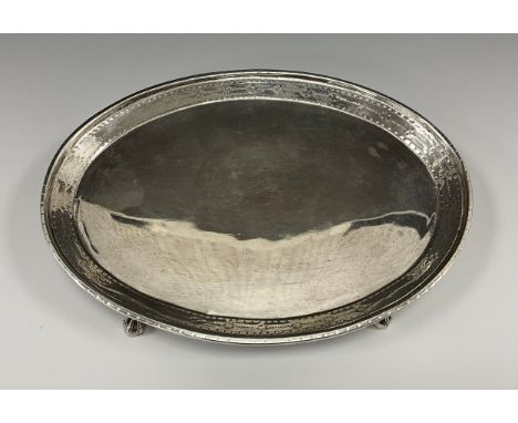 A George III silver oval teapot stand, bright cut and punch beaded collar, ball and claw feet, indistinct makers marks, Londo