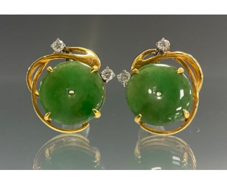 A pair of diamond and jade earrings, green jade discs within free form 18ct gold vortex mounts with two round brilliant cut d