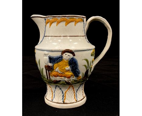 A 19th century pearl ware Prattware jug, moulded in relief decoration of gentleman with his ale, 14cm high