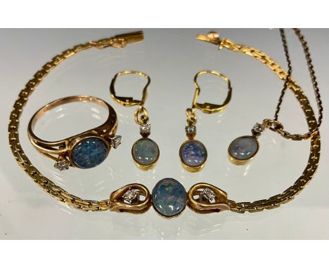 An opal and diamond five piece parure, comprising ring, pendant, bracelet and pair of earrings, the ring with central circula