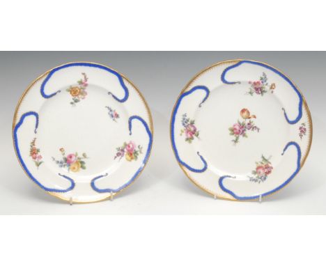 A Mintons shaped circular plate, decorated in the manner of Sevres, with floral sprays within blue and gilt feuille de choux 