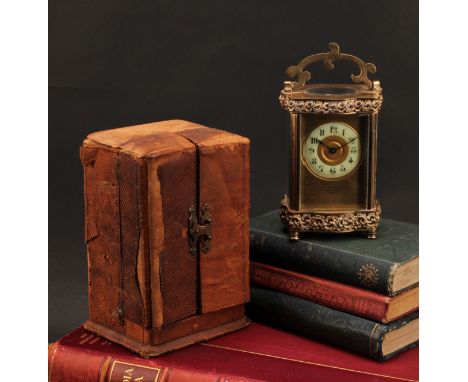 A late 19th century lacquered brass carriage timepiece, 5cm clock dial inscribed with Roman numerals, the front plate inscrib
