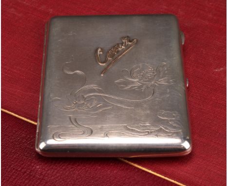 A Russian silver rounded rectangular cigarette case, hinged cover engraved in the Art Nouveau taste with flowers on sinuous w