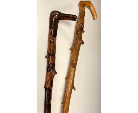 An interesting folk or possible trench art, carved walking stick, the handle carved as the head of a stylised bird, the shaft