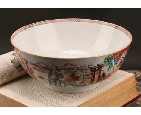 An 18th century Chinese porcelain punch bowl, hand-painted with panels depicting domestic scenes within scroll borders, picke