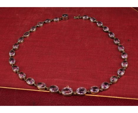 A single strand necklace of silver mounted graduated faceted pale amethysts, the clasp marked 800, 40cm long overall, early 2