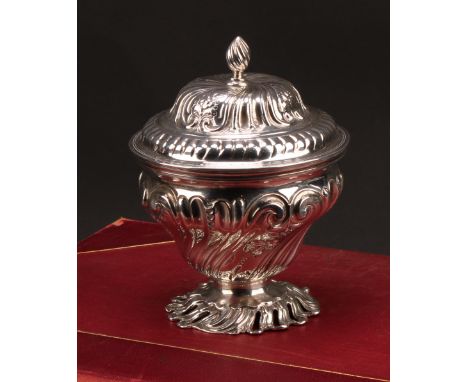 An early George III silver ogee sugar box, in the Rococo taste, cast foot, 14.5cm high, William Plummer, London 1761, 316g