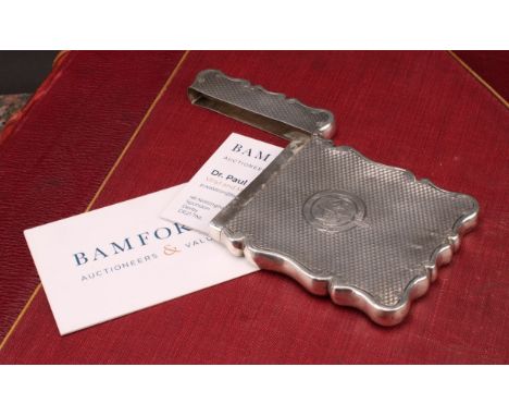 A Victorian silver shaped rectangular visiting card case, engine turned, 9cm long, Cohen &amp; Charles, Birmingham 1899